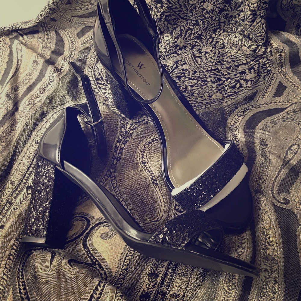 Black open toe heel. Never worn.